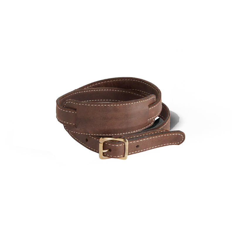 Brown leather belt with a brass buckle on a white background