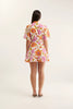 Woman wearing a floral dress on a white background