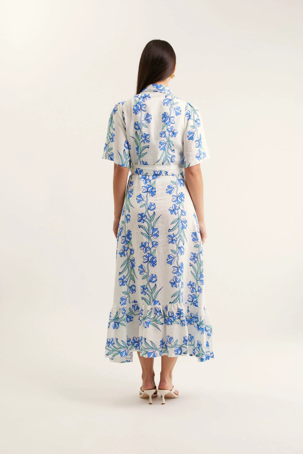 Woman wearing a floral dress on a white background
