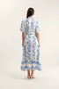 Woman wearing a floral dress on a white background