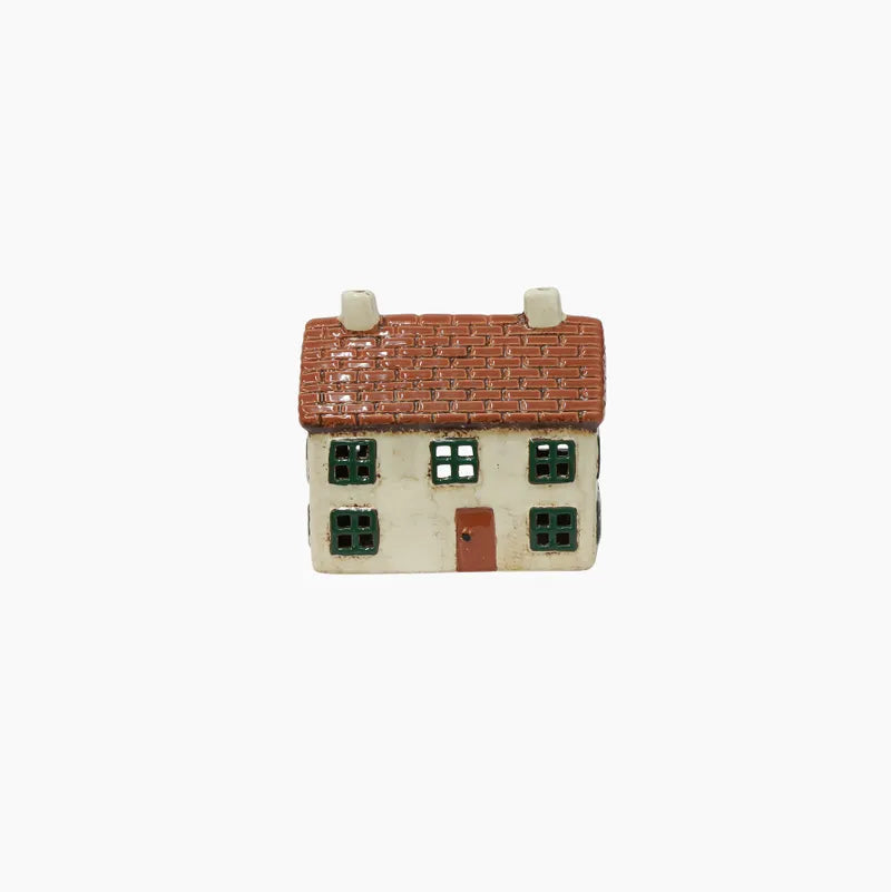 Small model of a house with a red roof on a white background