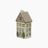 Decorative house-shaped lantern with a white base and brown roof on a white background