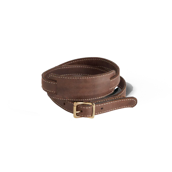 Brown leather belt with a brass buckle on a white background