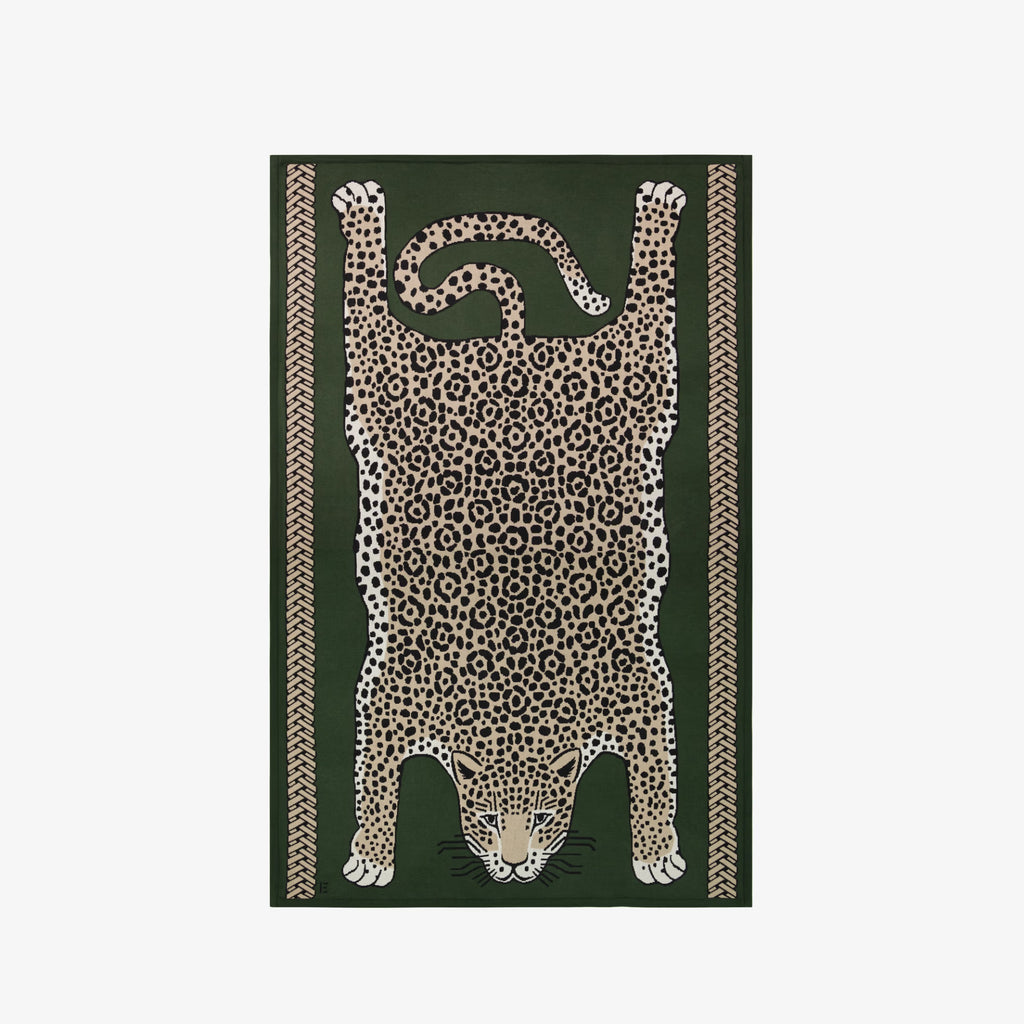 Leopard print design on a green background
